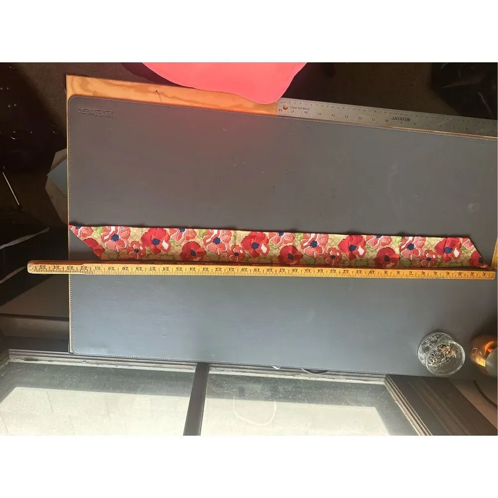 COACH silk twilly scarf orange poppy and tan signature Cs background